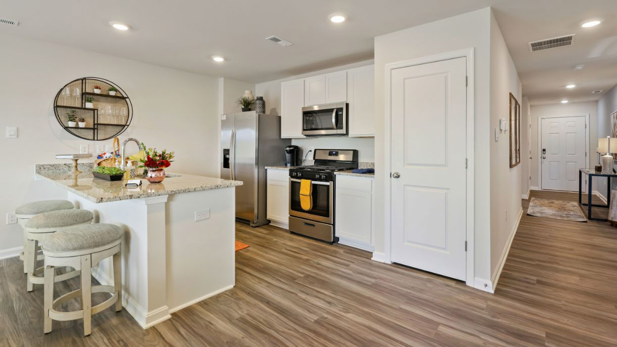 modern front entrance with view of the spacious kitchen