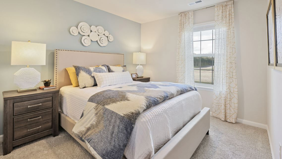 bedroom with beige carpet