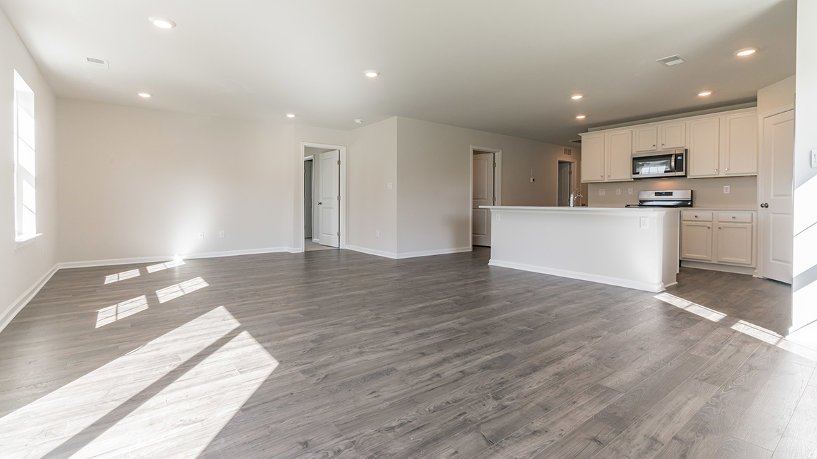 open concept kitchen with island and stainless steel appliances