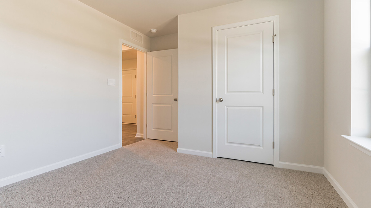 bedroom with beige carpet