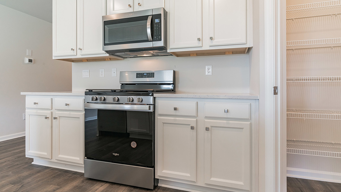 open concept kitchen with island and stainless steel appliances