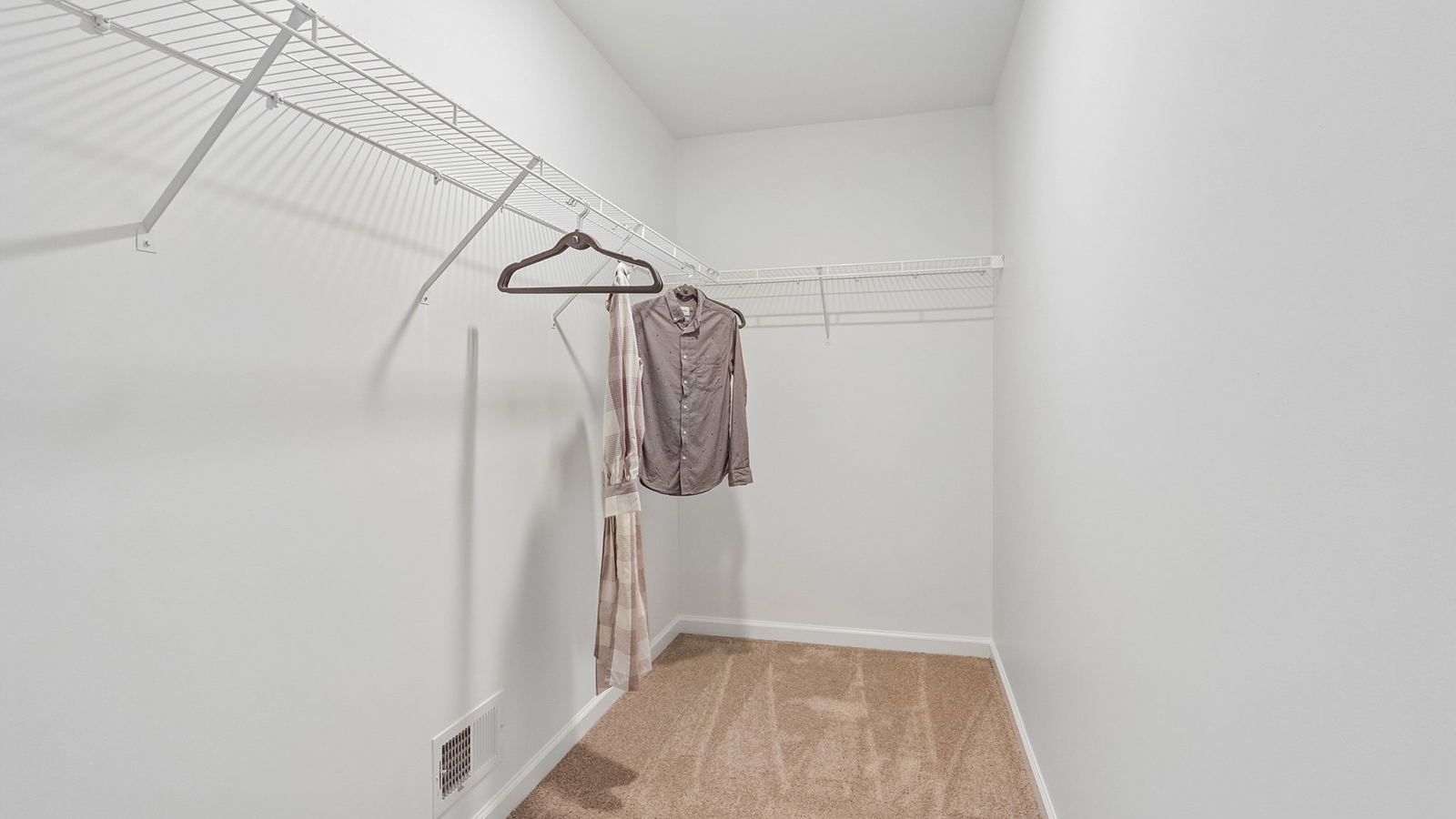 walk in closet in the primary suite