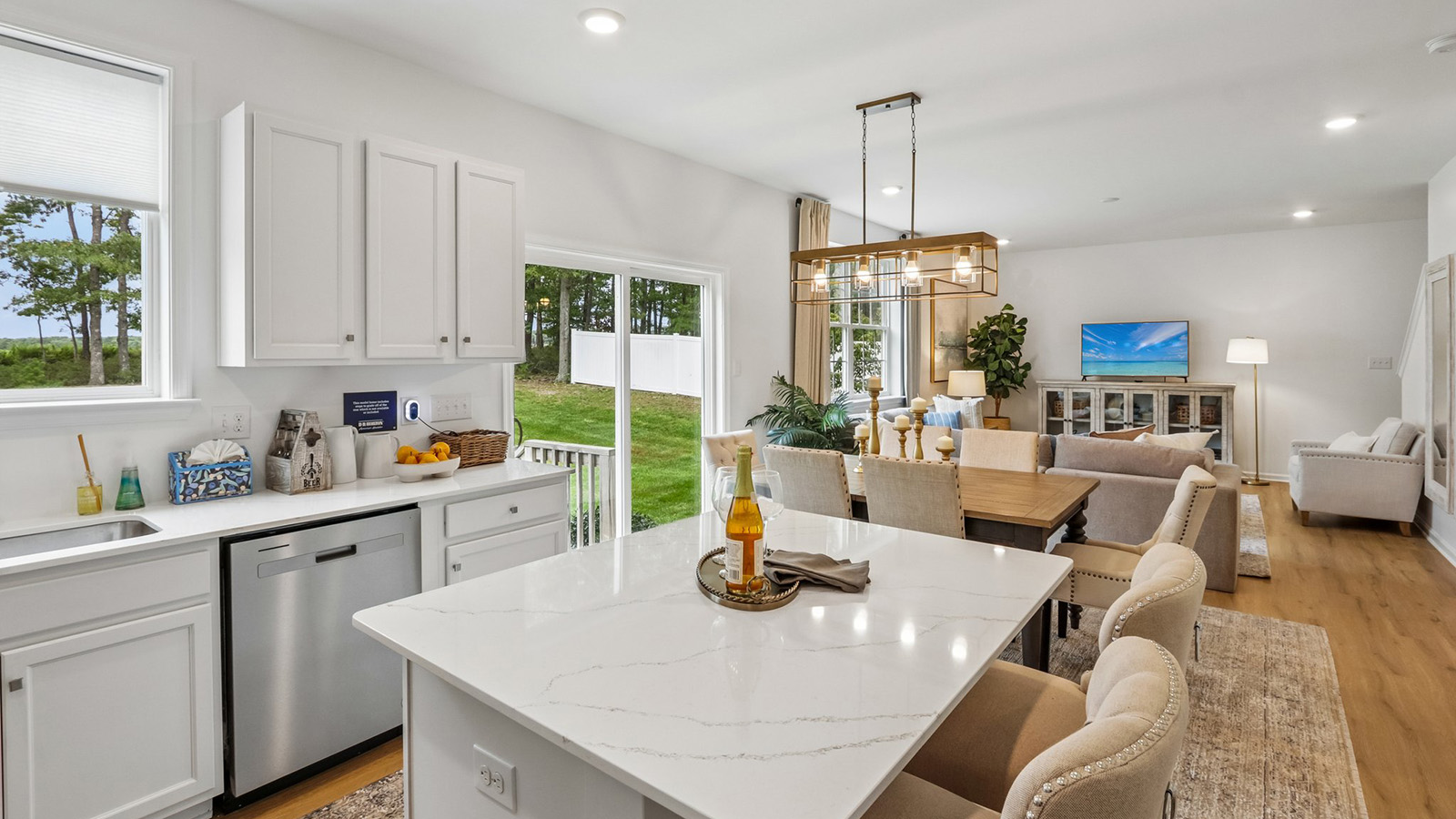spacious kitchen with large quartz island