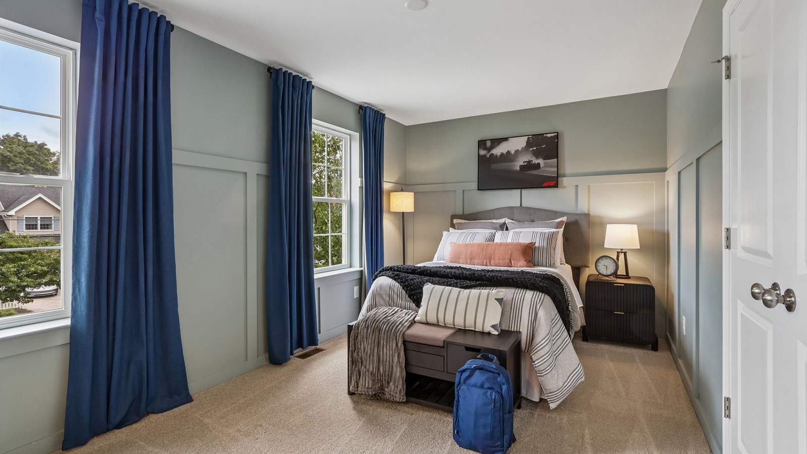 spacious and modern bedroom with large windows