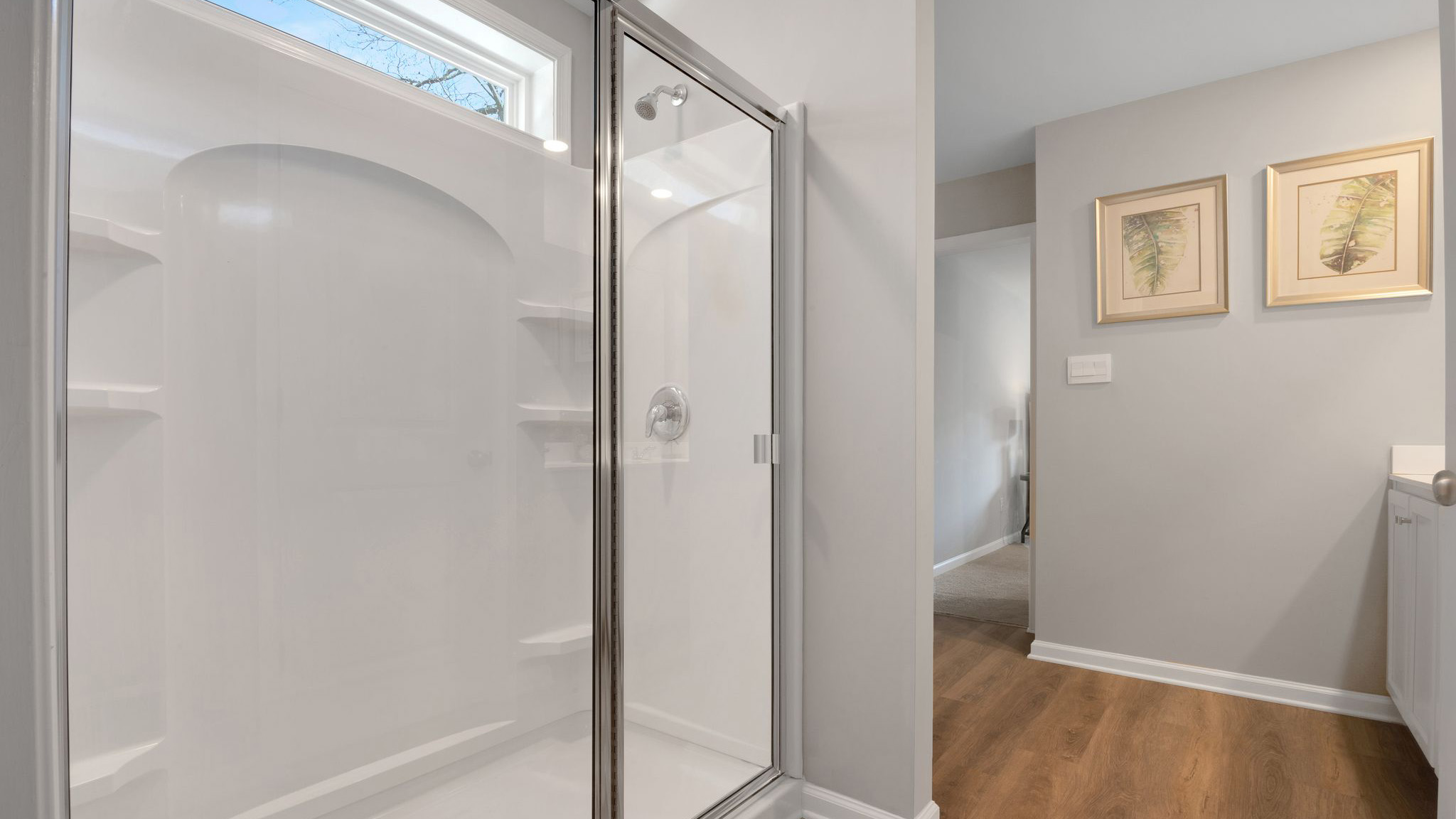 spacious full bath off the primary with double vanity