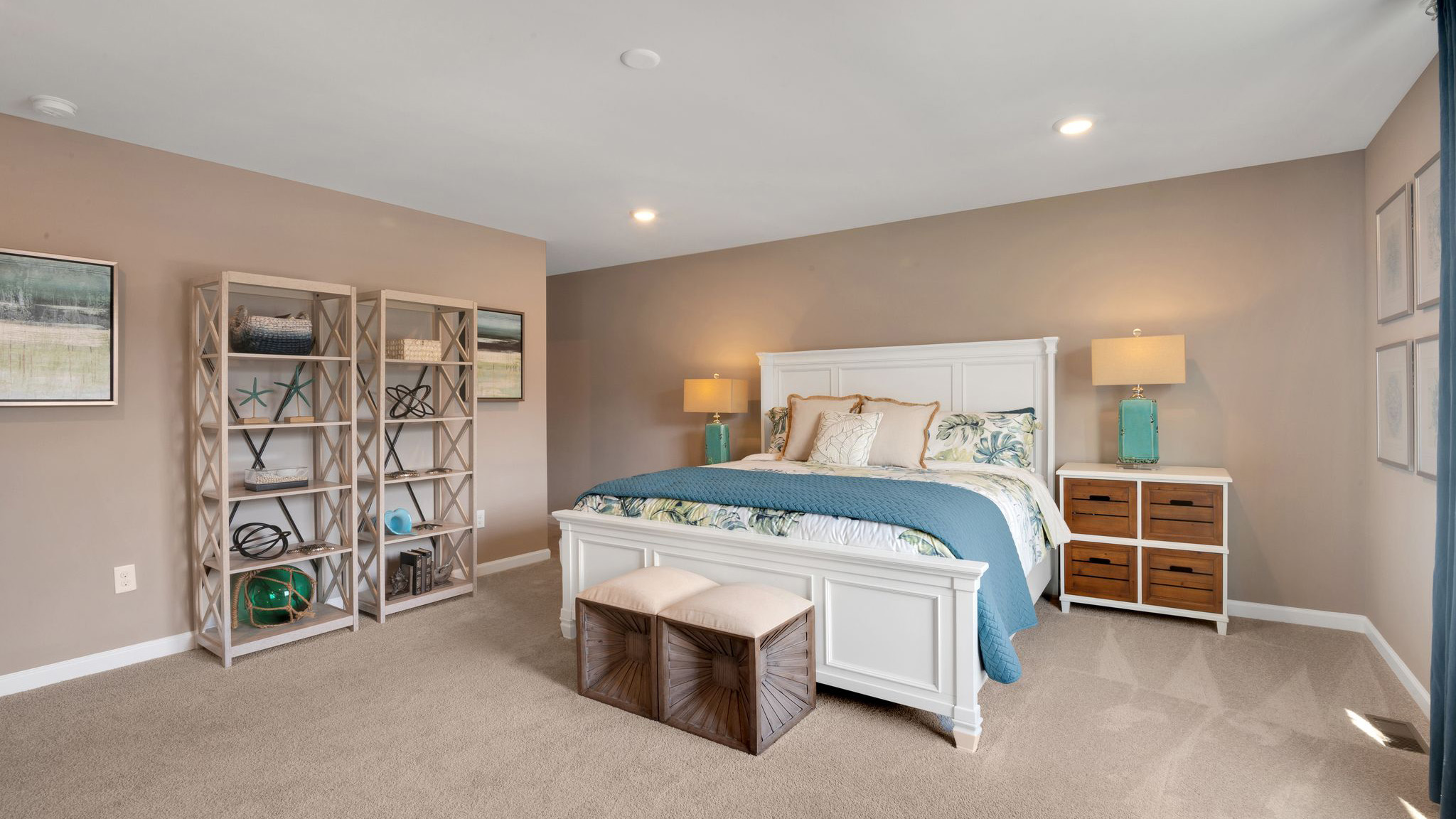 primary suite with large walk in closet and full bath