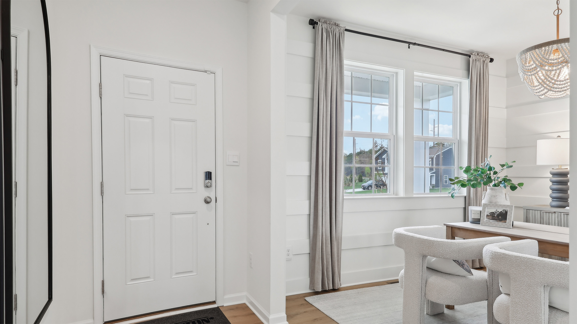 modern front entrance with the flex room off to the side