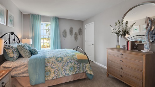 bedroom with beige carpet
