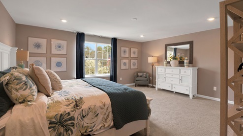 bedroom with beige carpet