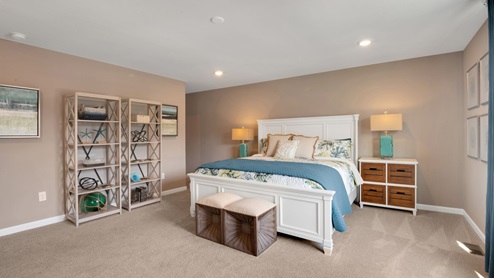bedroom with beige carpet