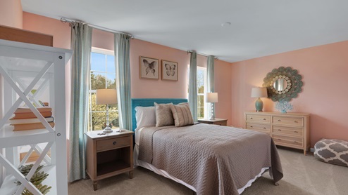 bedroom with beige carpet