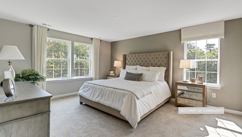 bedroom with beige carpet