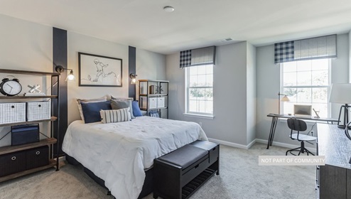 bedroom with beige carpet