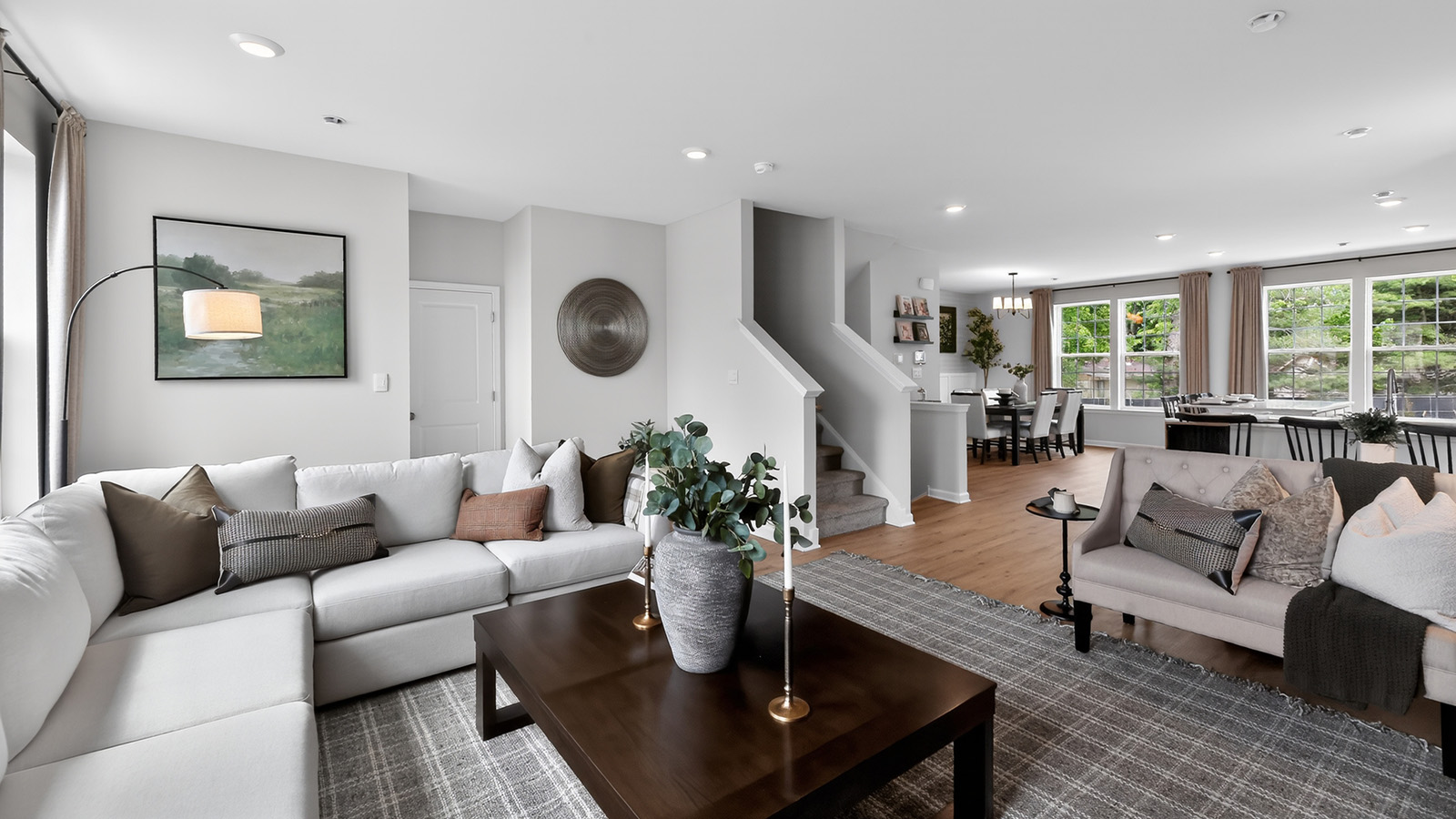 open concept main floor featuring the living room and kitchen with a mid-century modern design