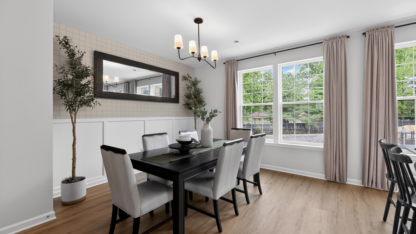 large kitchen island with white cabinetry and stainless steel appliances