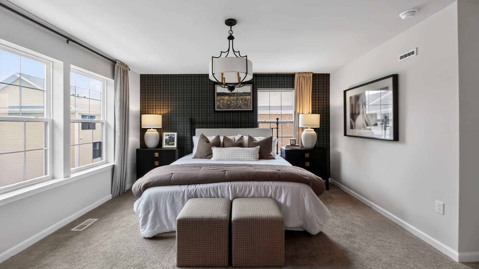 primary suite in the Elmore featuring an en-suite bath and large walk in closet