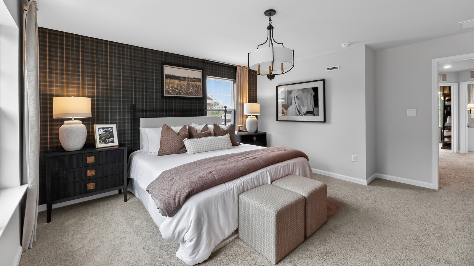 Elmore model primary bedroom with mid century modern design and plaid wallpaper
