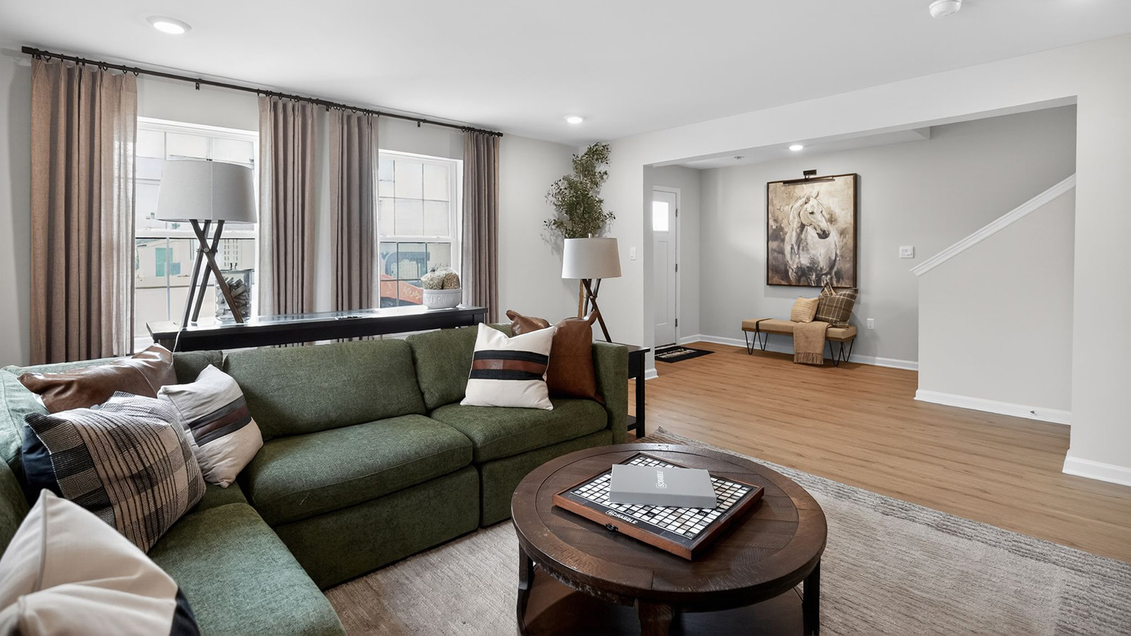 mid century modern living room on the first floor with a green couch