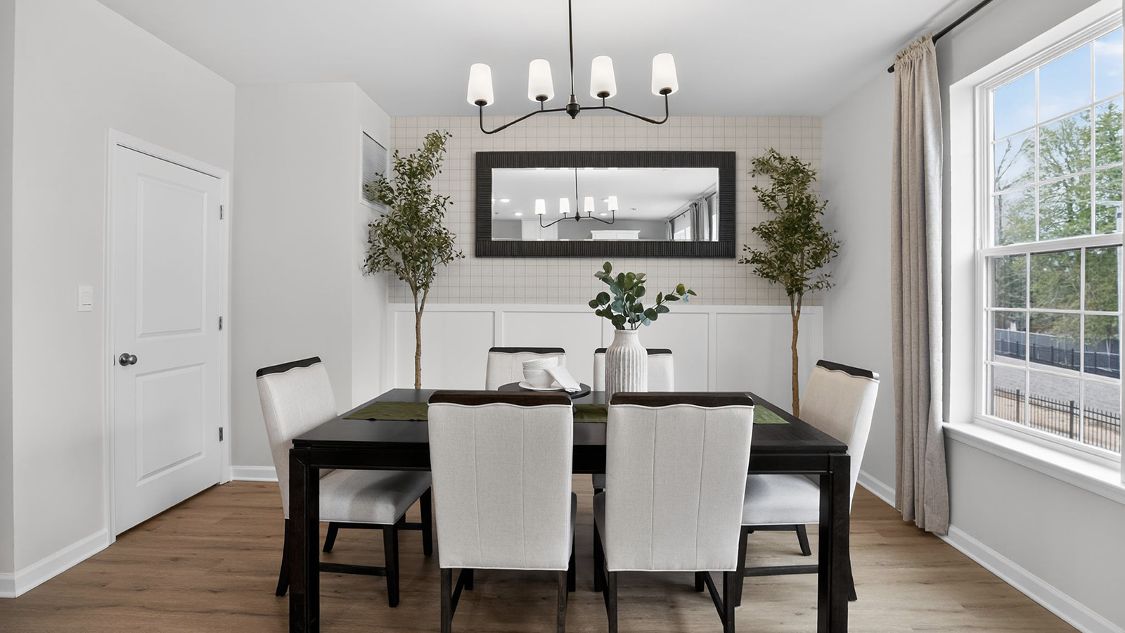beautiful dining table with mid century modern design and beautiful light fixture