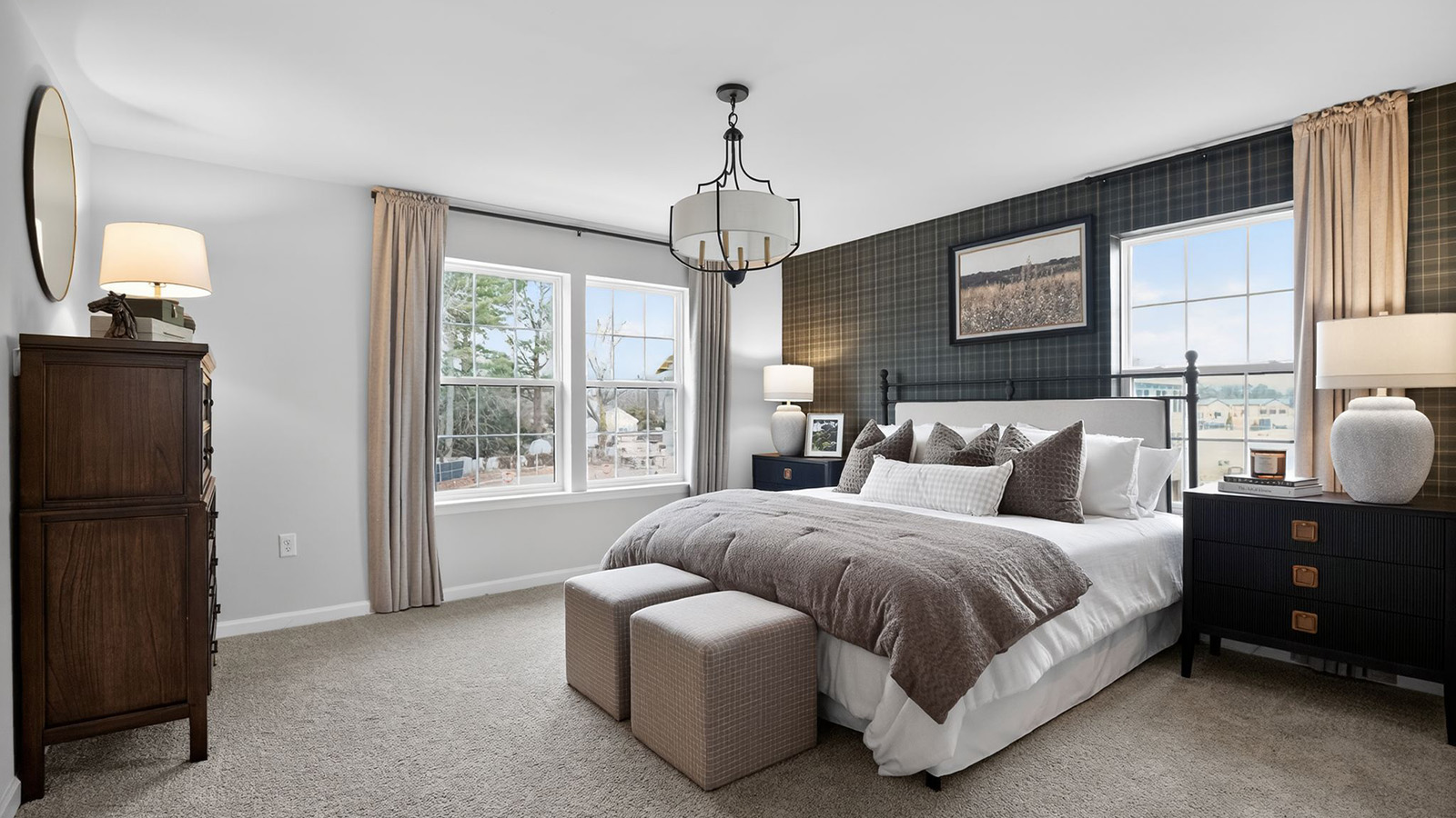 primary bedroom with mid century modern design and beautiful light fixture