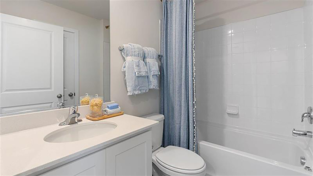 full bath in the hall with blue accents