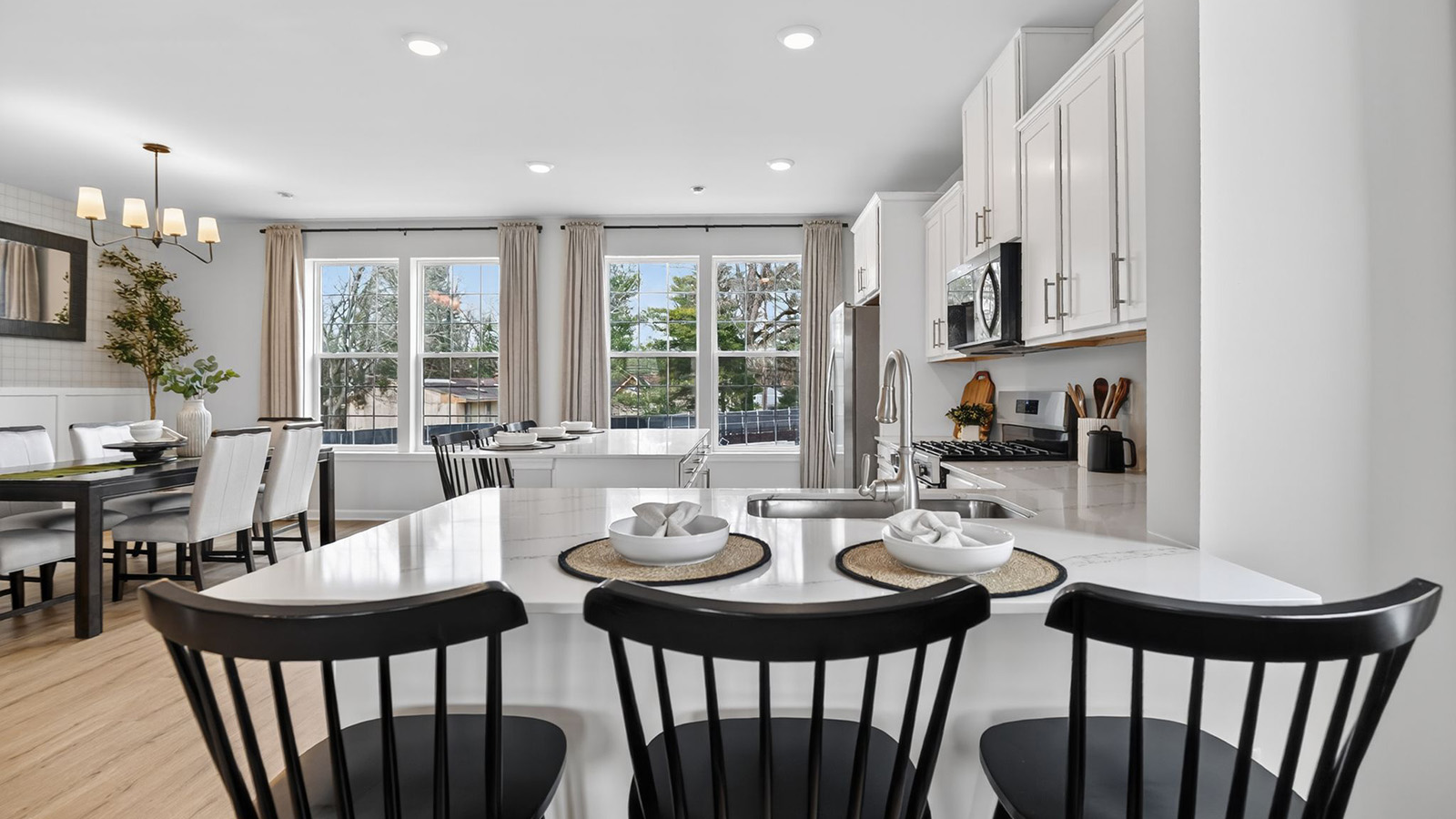 Elmore model main floor living with mid century modern design and large quartz island