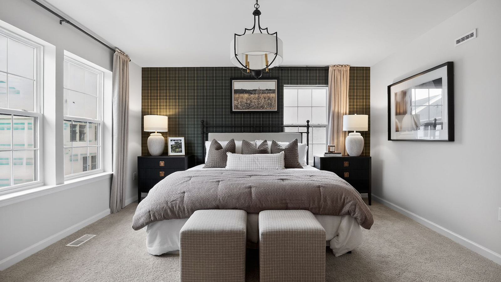 Elmore model primary bedroom with mid century modern design and plaid wallpaper