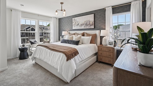 bedroom with beige carpet