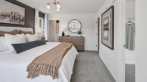 bedroom with beige carpet