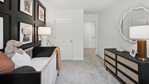 bedroom with beige carpet