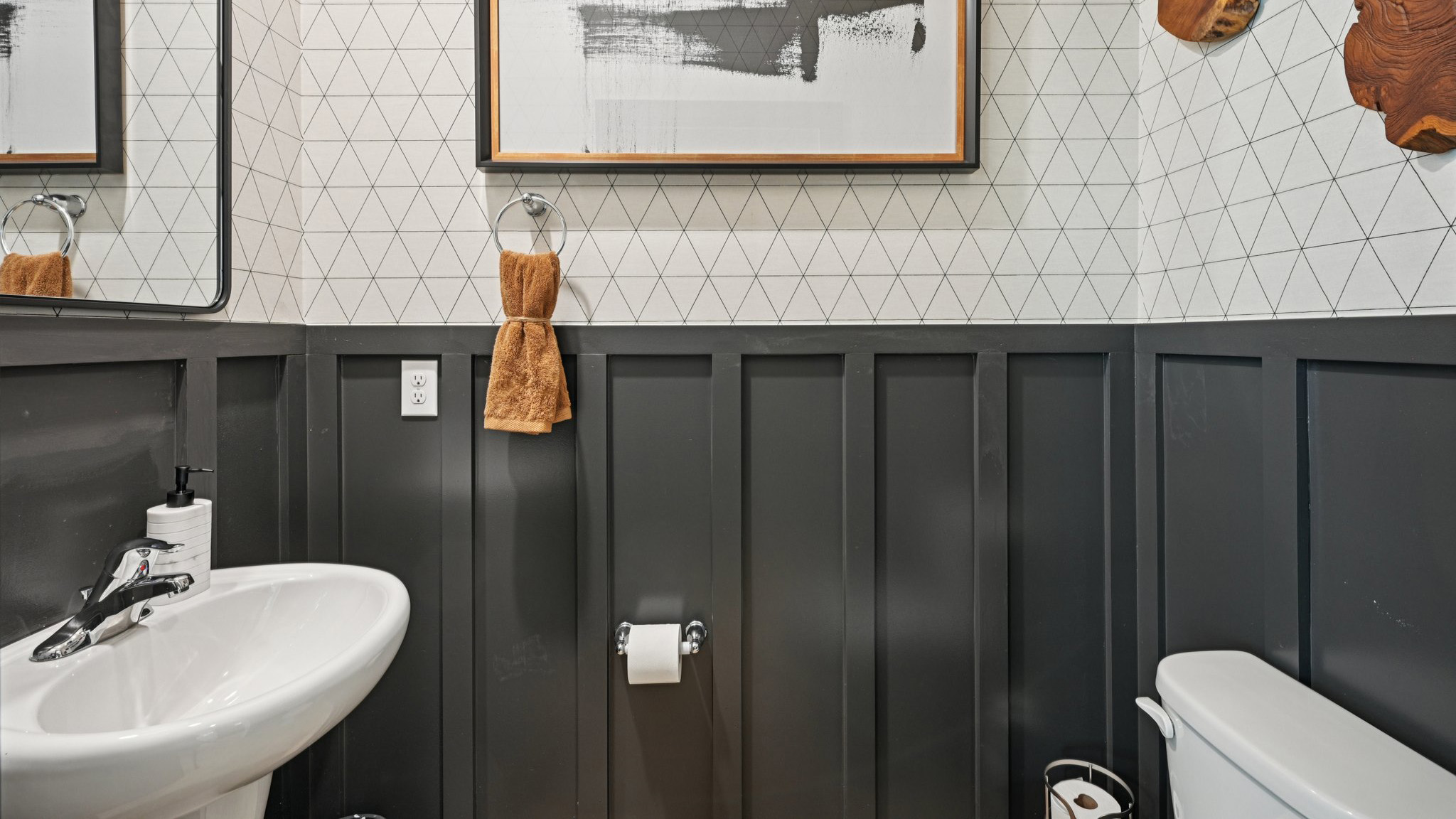 powder room on the first floor with modern color scheme