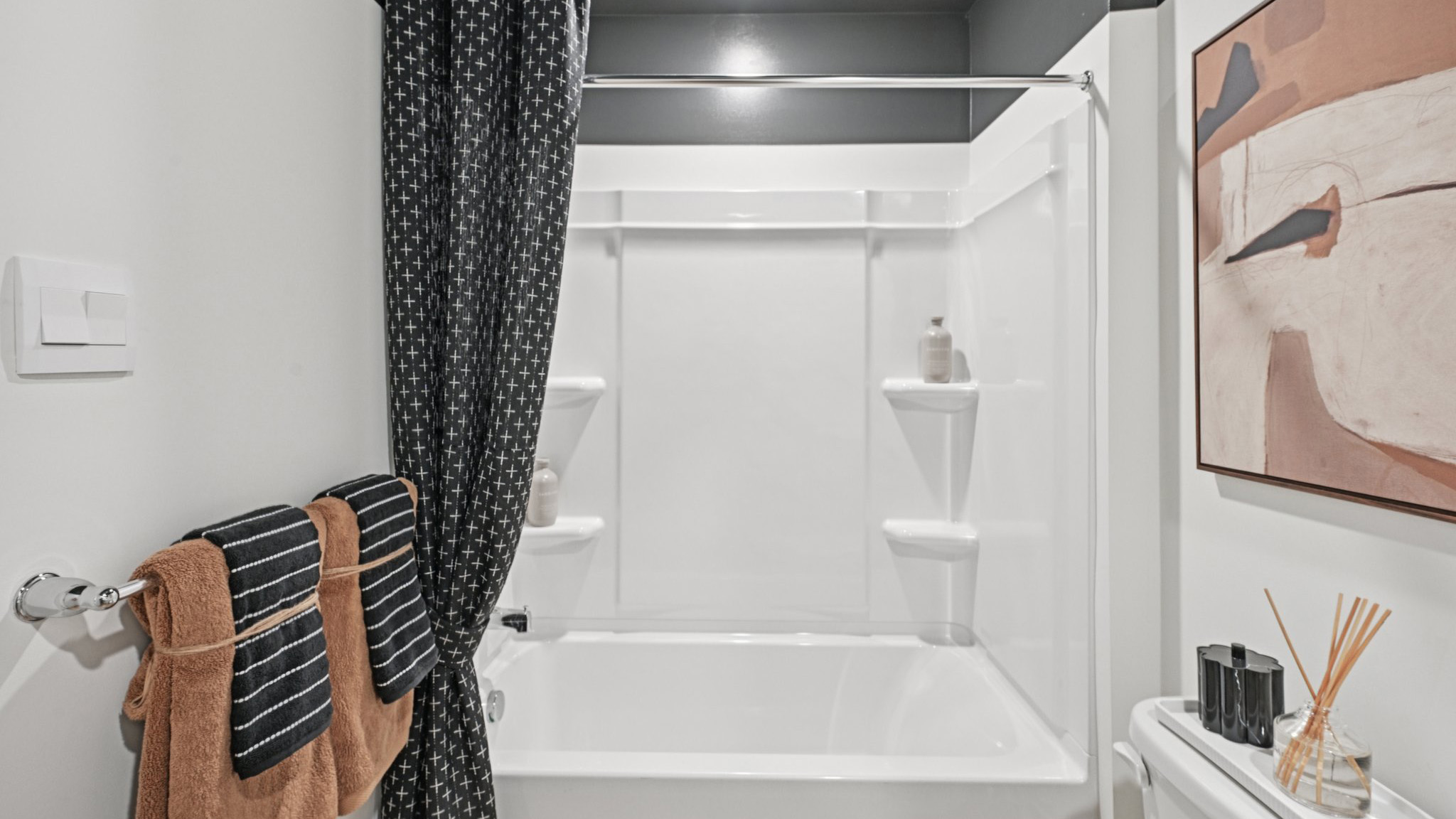 full bath on the second floor hall showcasing the shower