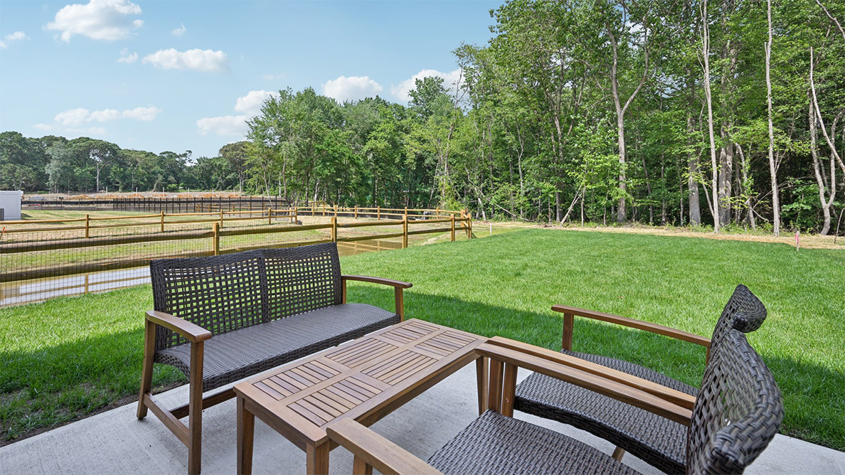 outside patio with green spaces and fence