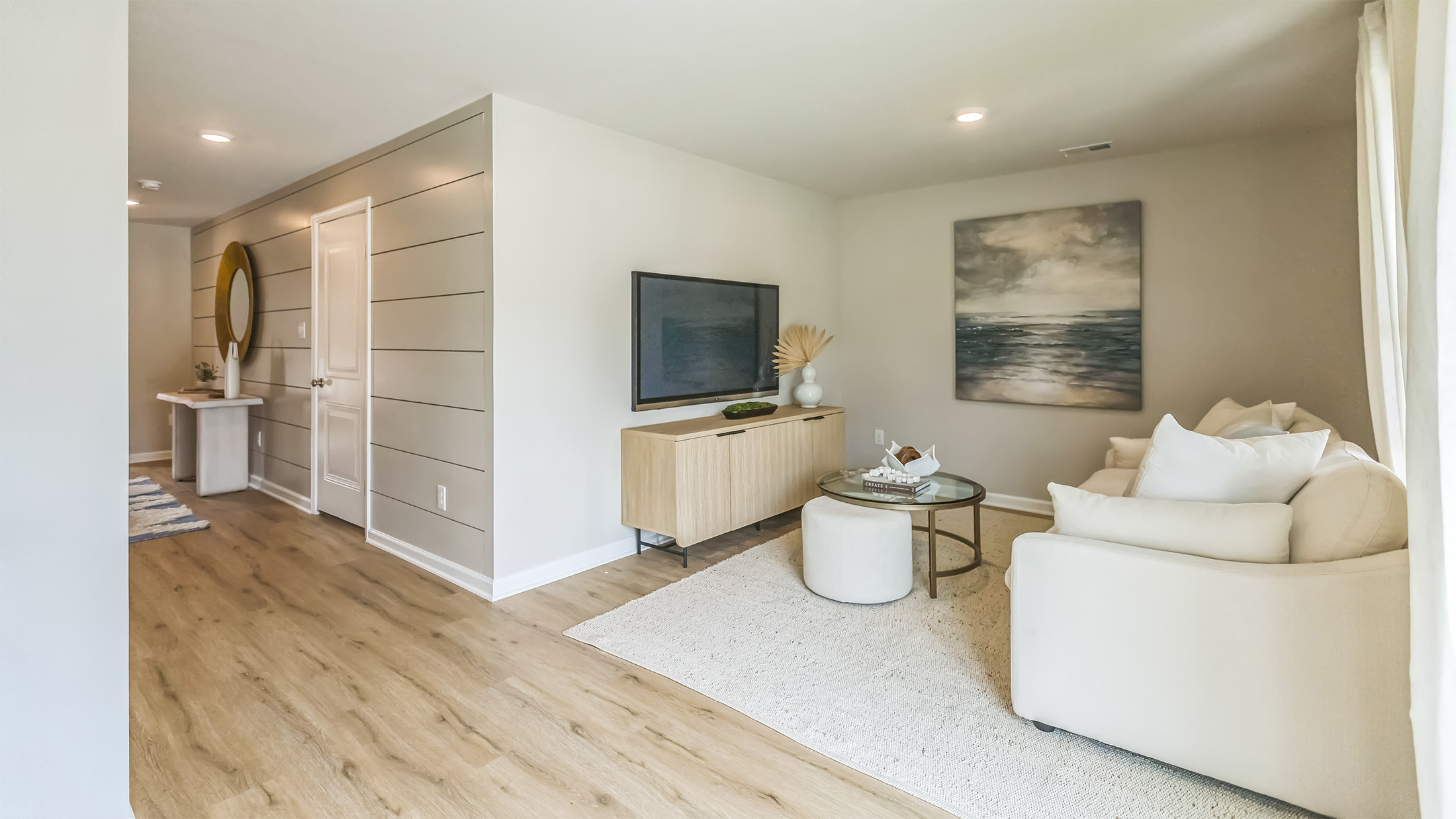 modern flex room with a coach and work out station