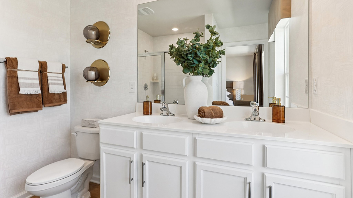 full bathroom off the primary with double vanity