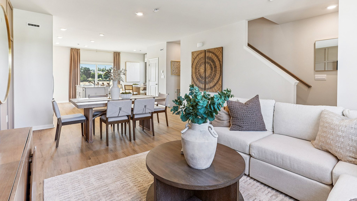 open concept living room with modern design and dining table behind