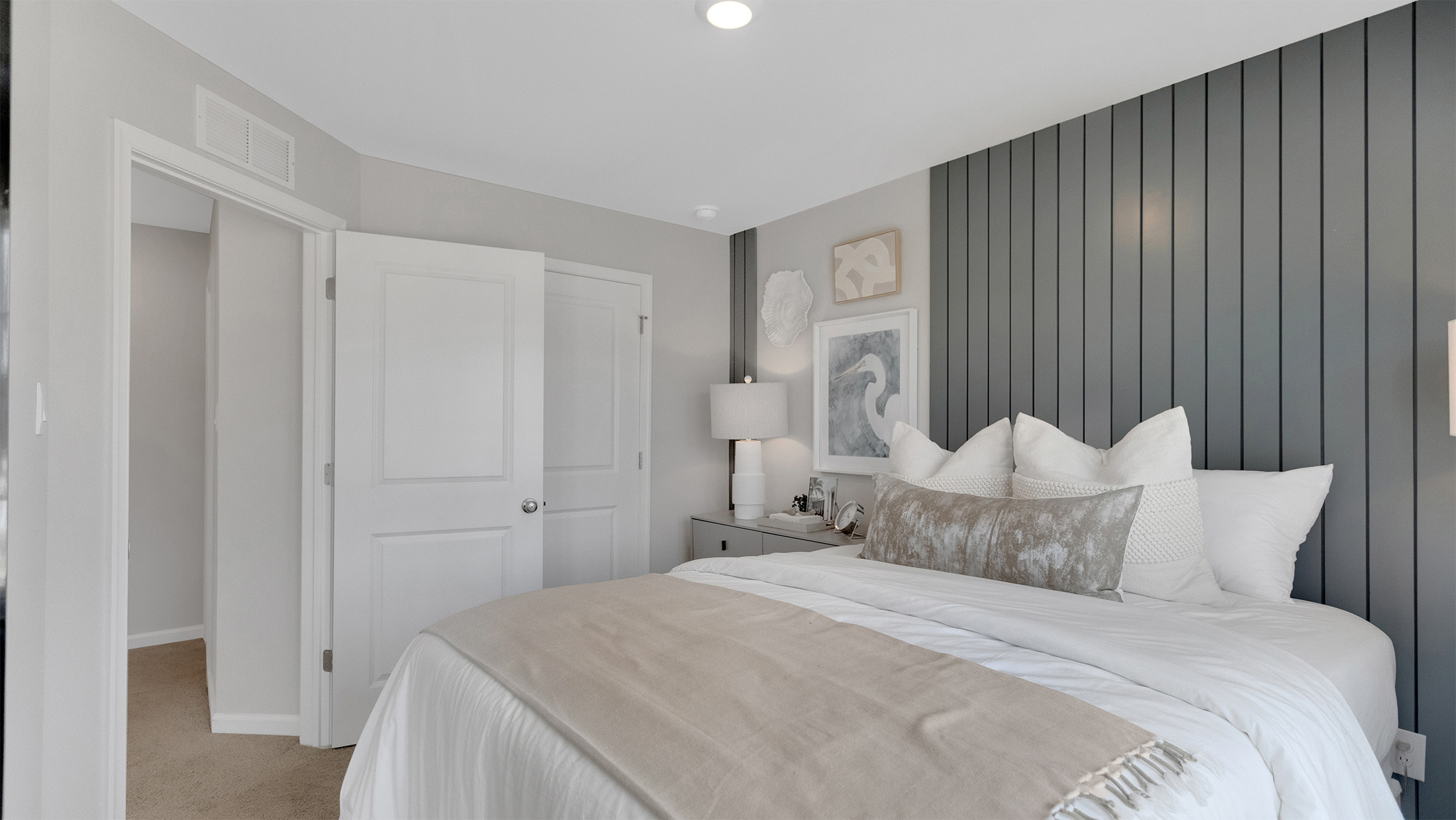 primary bedroom with ample space and a full bath and spacious closet
