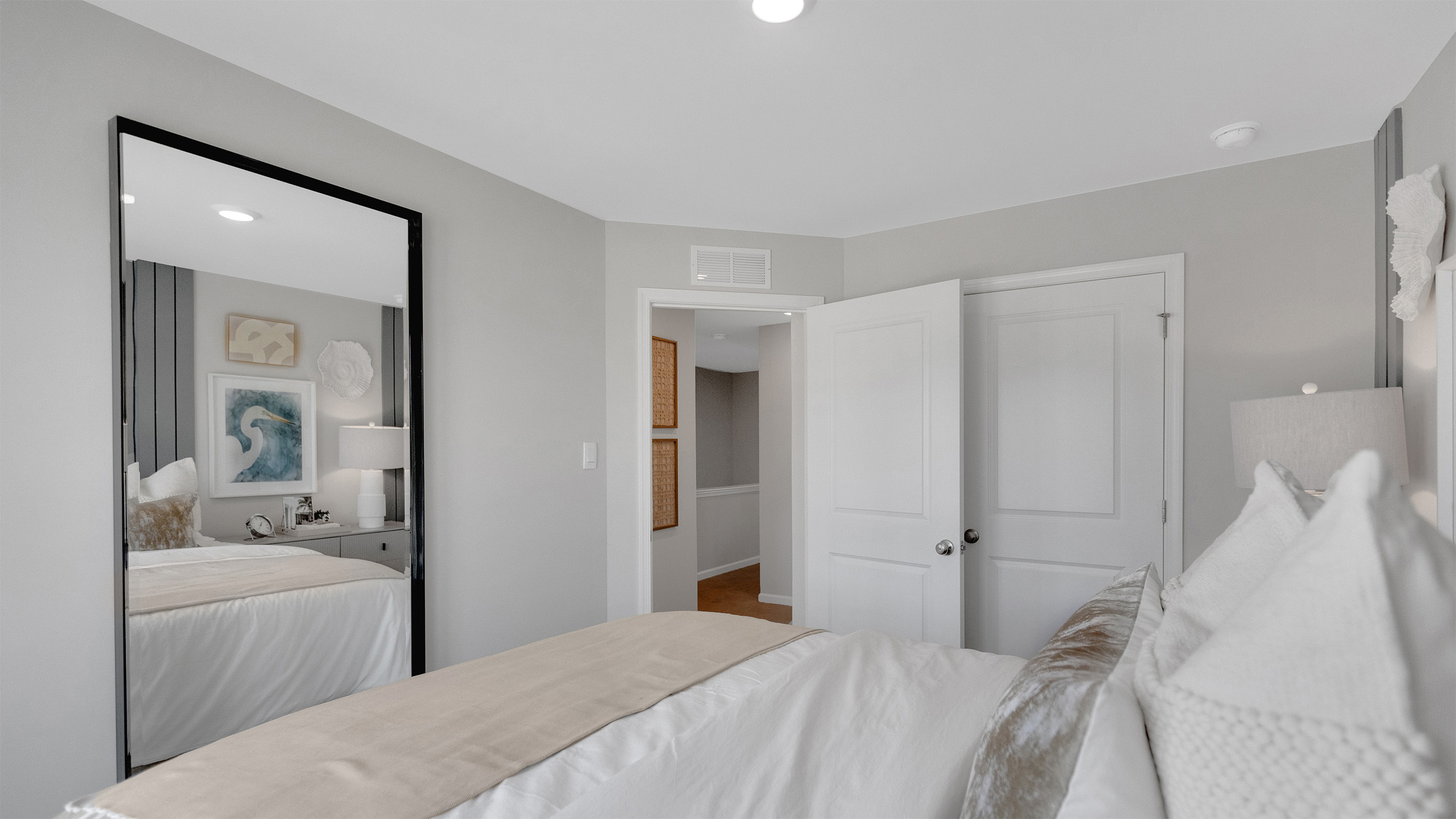 primary bedroom with ample space and a full bath and spacious closet