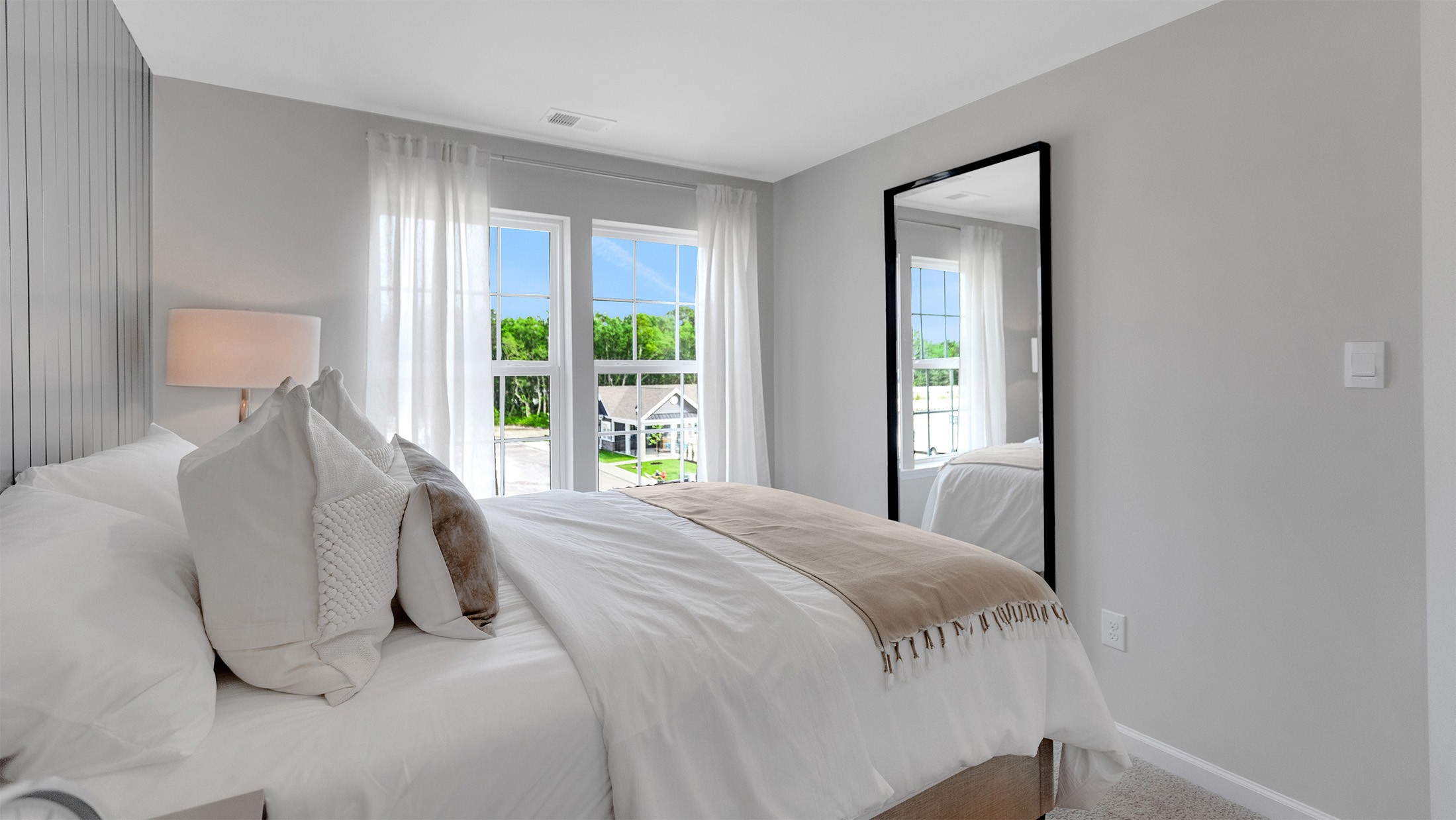 primary bedroom with ample space and a full bath and spacious closet