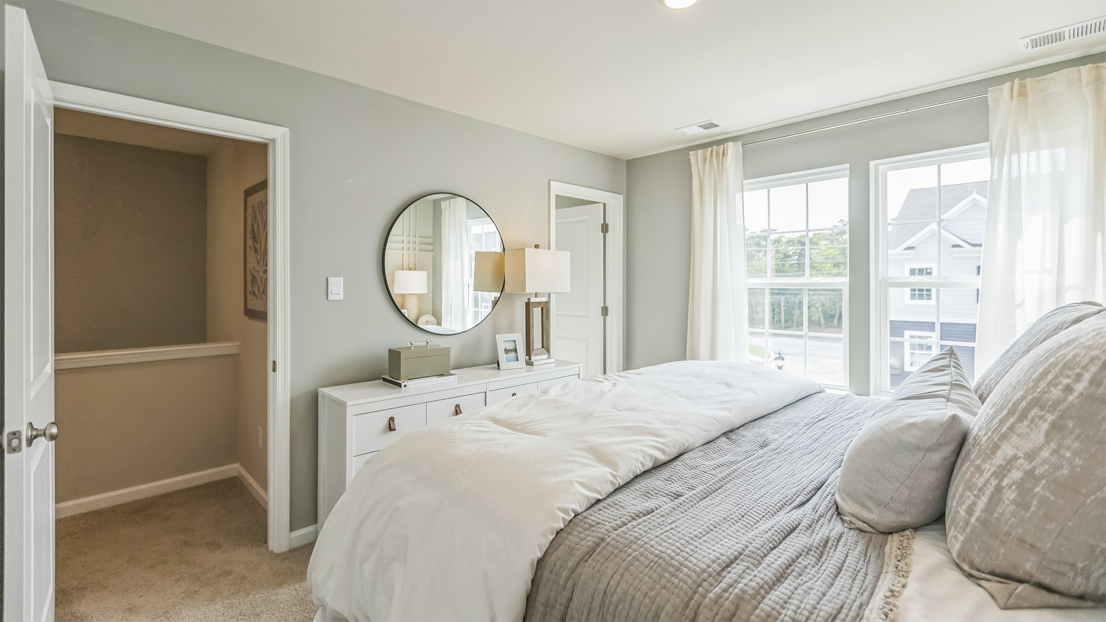 primary bedroom with ample space and a full bath and spacious closet