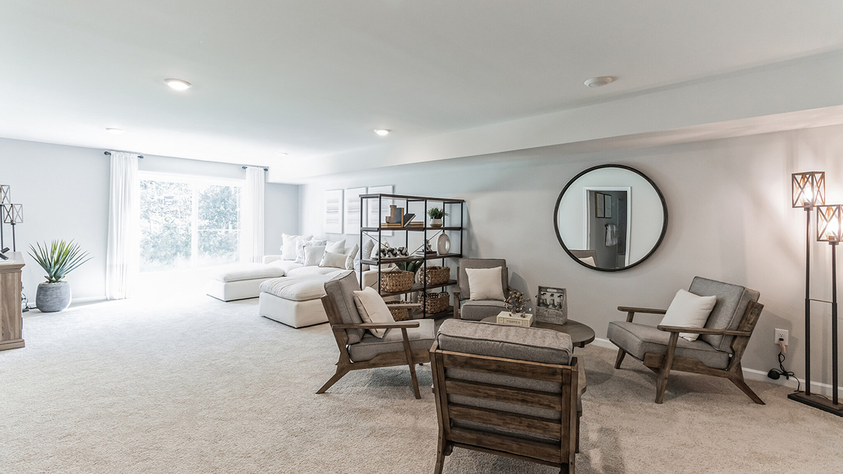 open concept basement with seating options to unwind