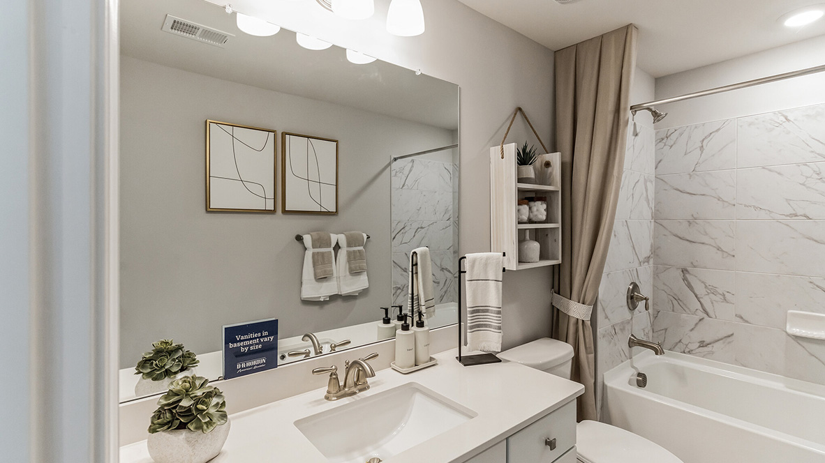 upstairs full bathroom with double vanity