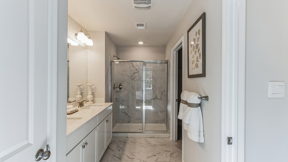 full bathroom with double vanity off the primary bedroom