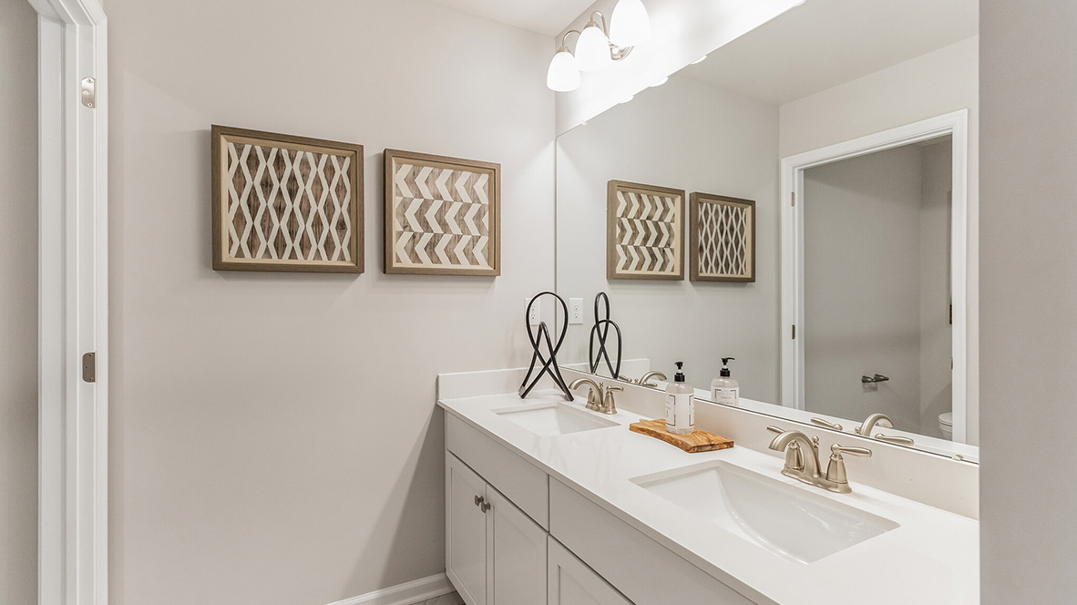 upstairs full bathroom with double vanity