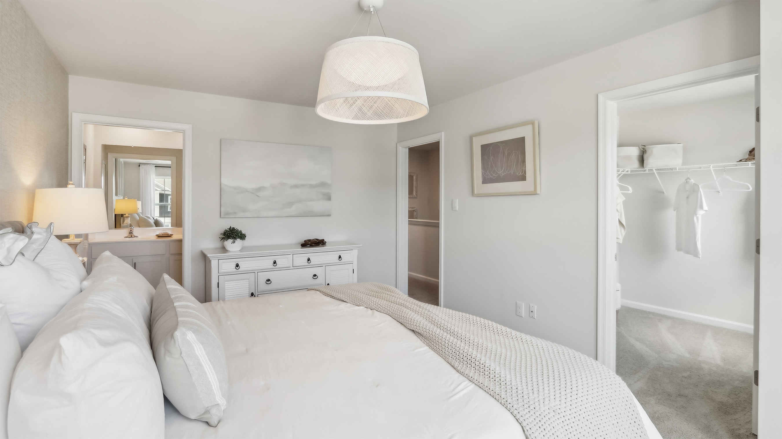 primary bedroom with modern design and walk in closet