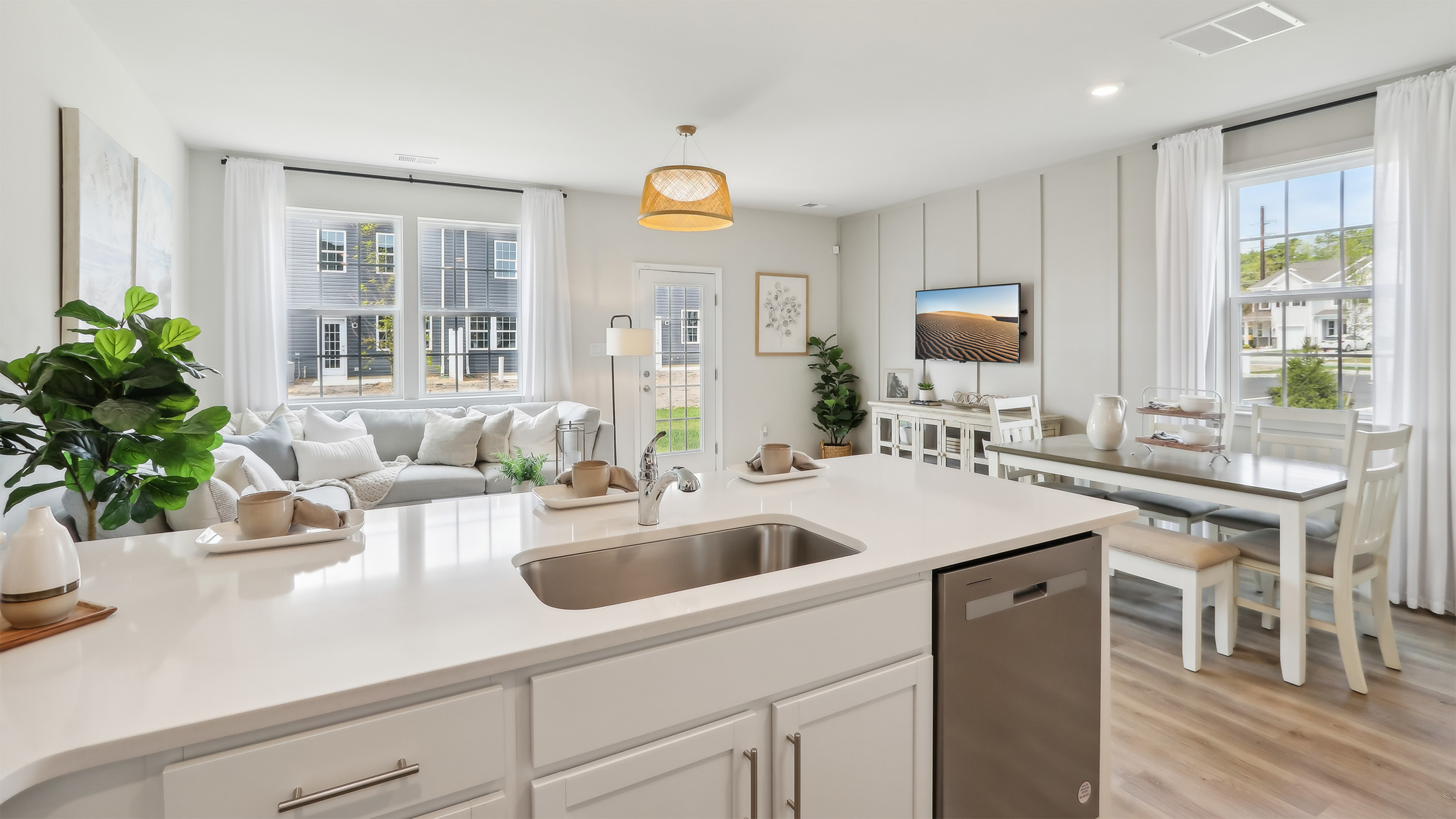 large kitchen island and open concept living room behind