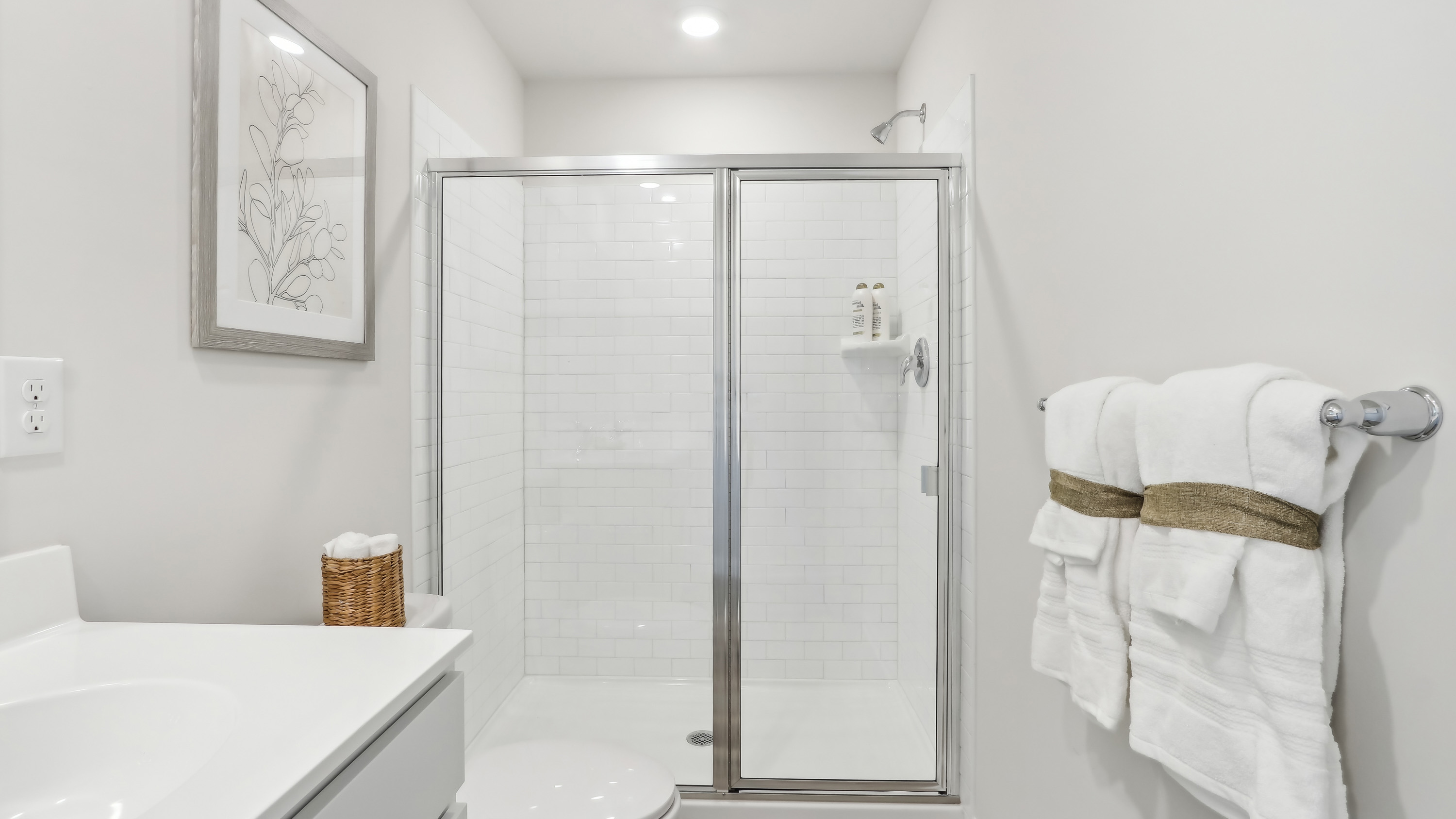 primary suite full bath with double vanity