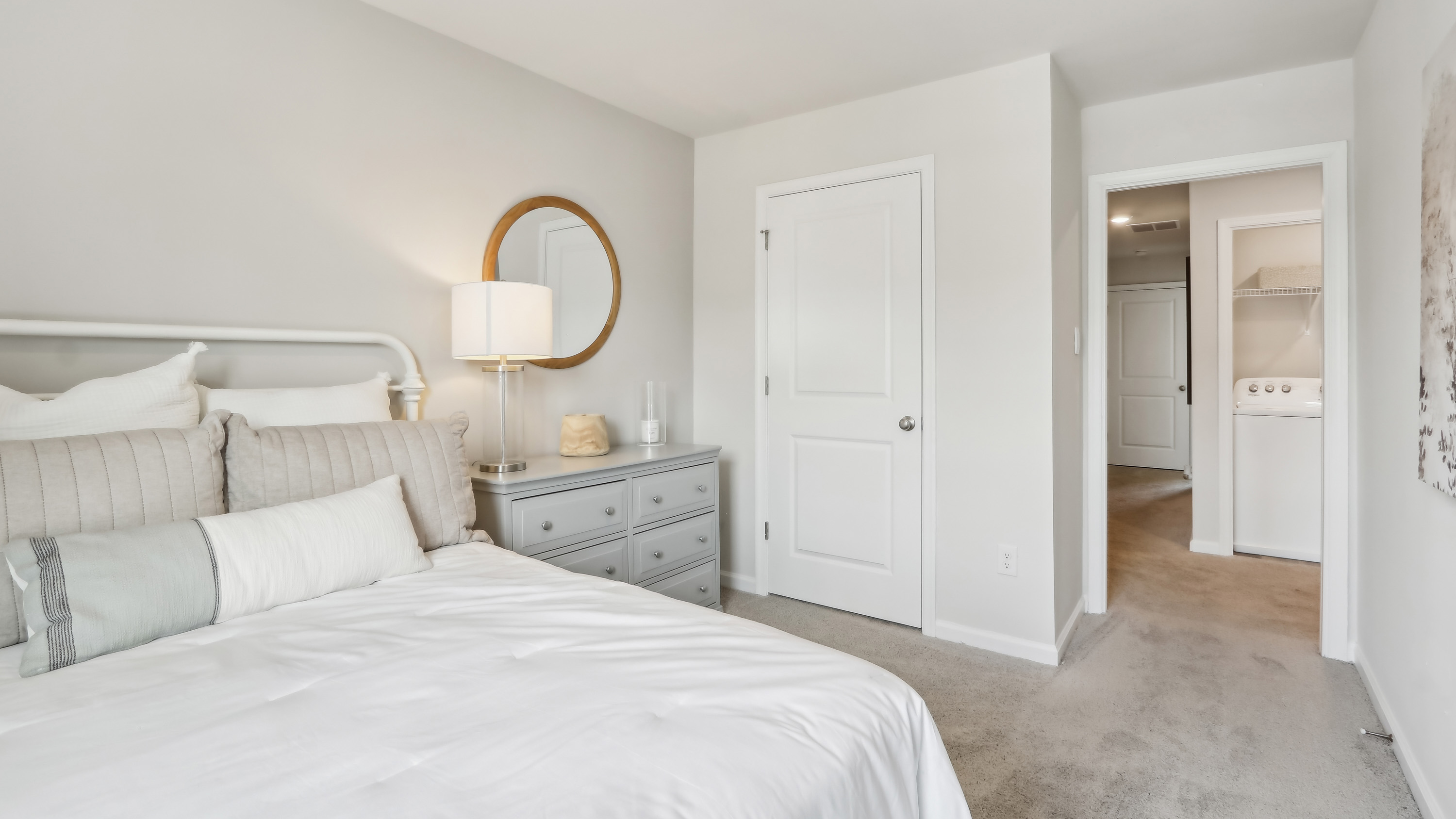 large bedroom with neutral tones throughout