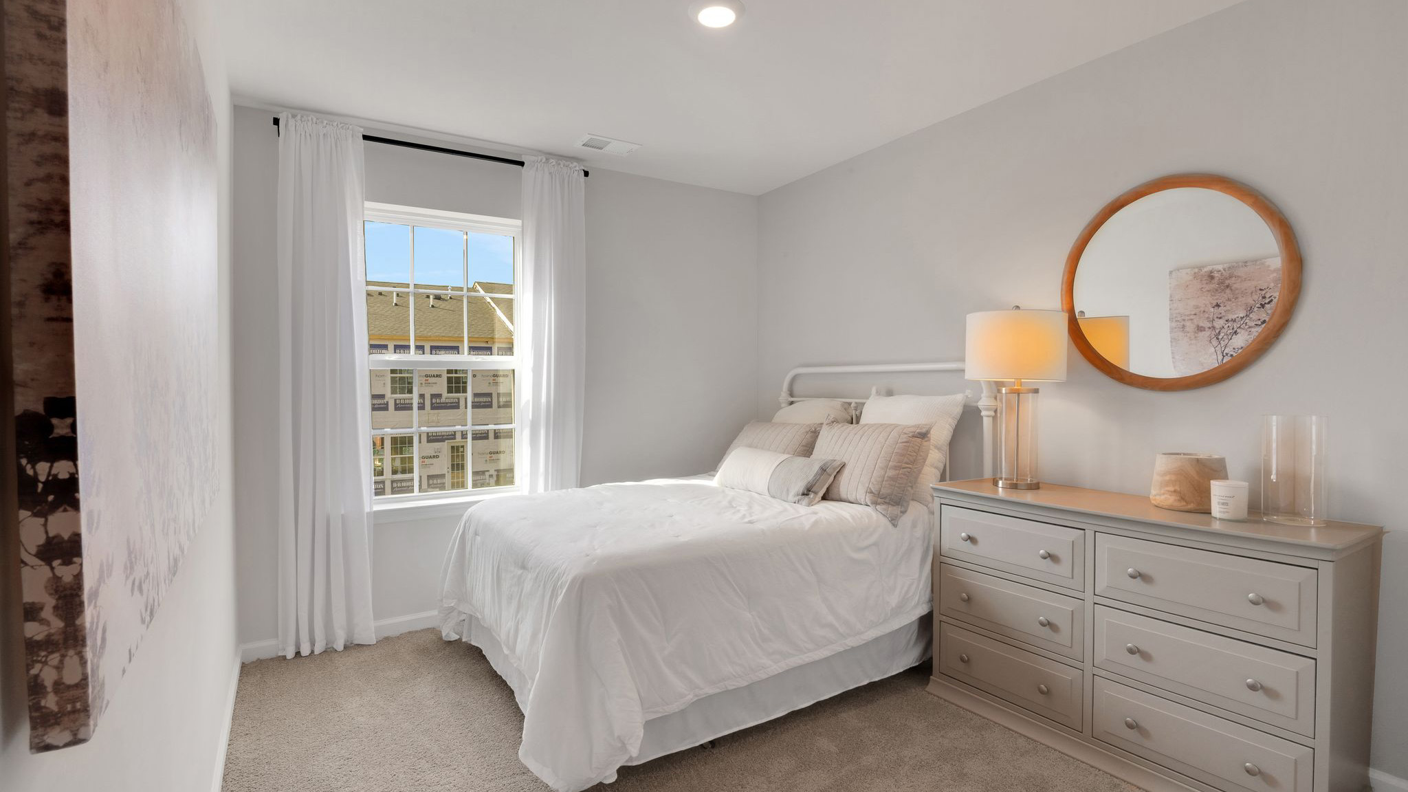 bedroom with beige carpet