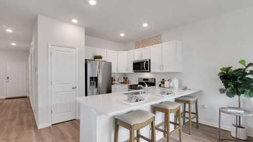 white kitchen with white island